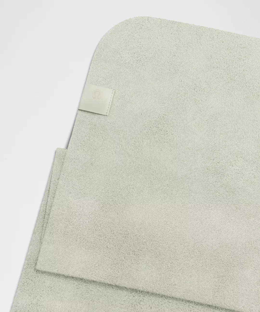 Light green fabric with a label on a white background