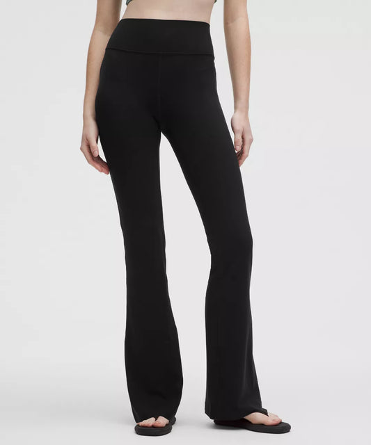 Person wearing black pants on a white background