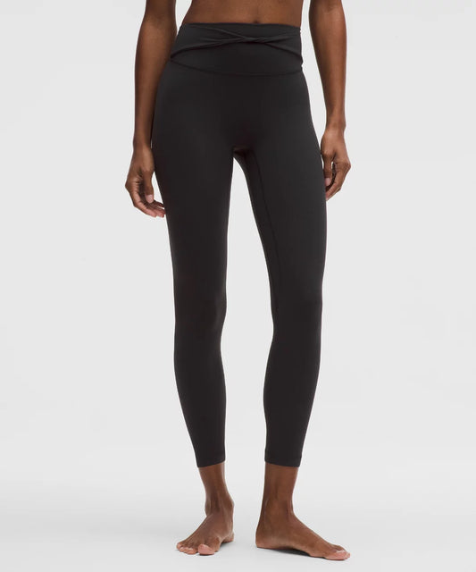 Black leggings worn by a person on a white background