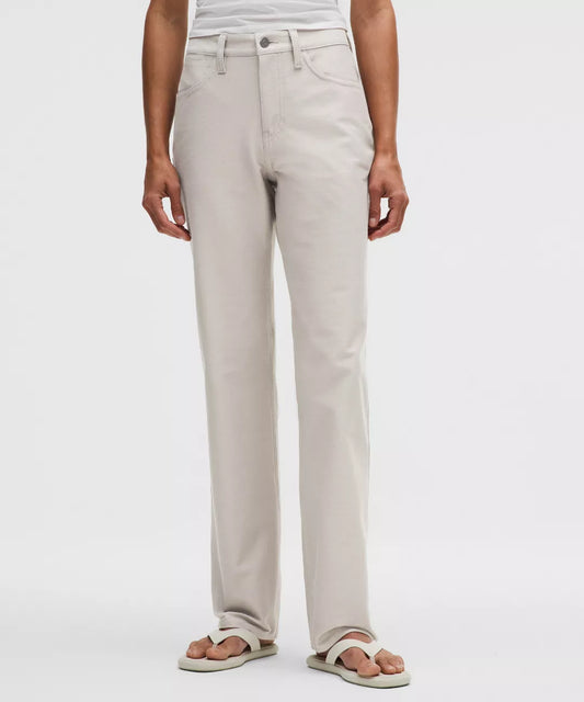 Person wearing beige pants on a white background