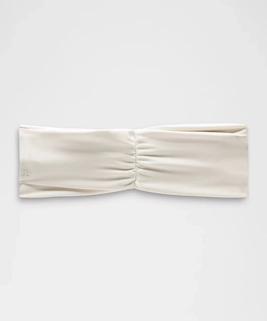 Beige headband on a white background