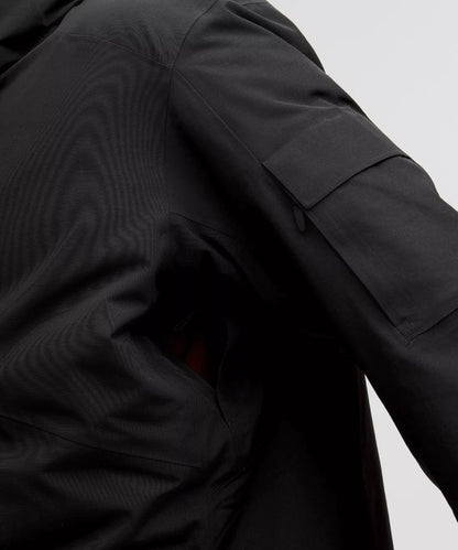 Close-up of a black jacket with a pocket on a light gray background