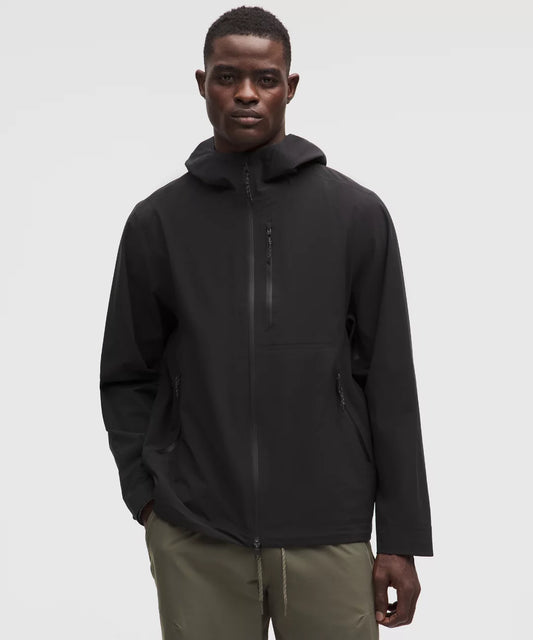 Man wearing a black jacket on a white background