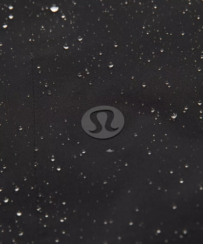 Black surface with water droplets and a visible brand logo.