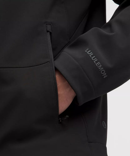 Black Lululemon jacket with a close-up of the sleeve and logo.