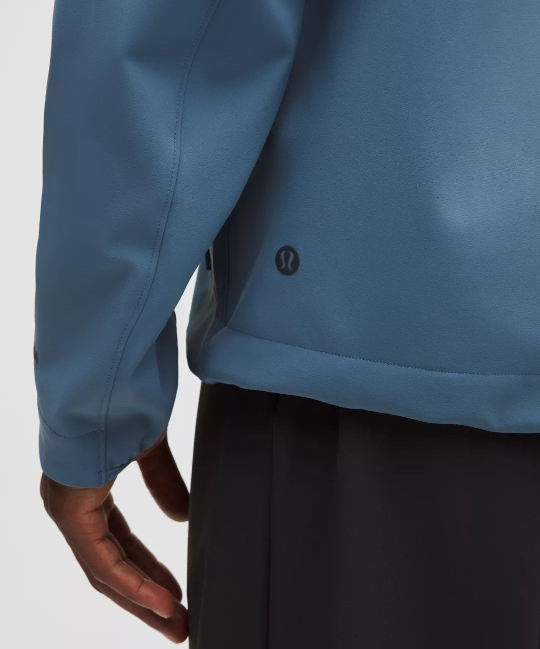 Close-up of a blue jacket with a blurred background