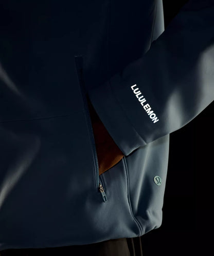 Dark blue jacket with Lululemon branding on a black background