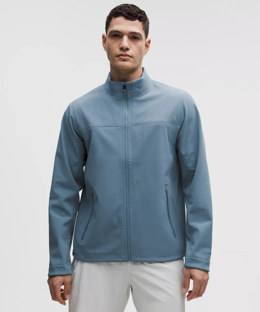 Man wearing a blue jacket on a white background