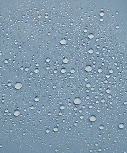 Water droplets on a blue glass surface