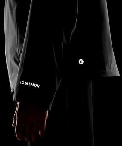 Black Lululemon jacket with logo on a black background