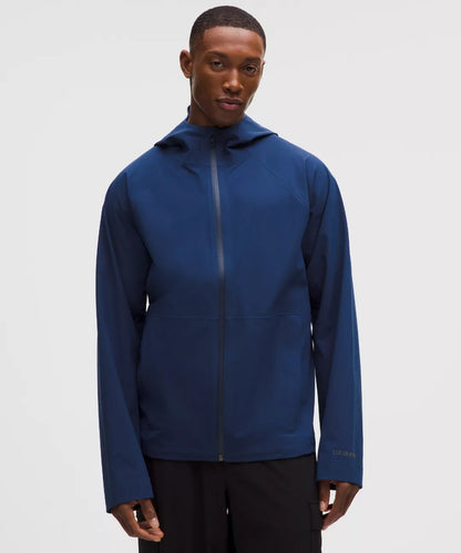 Man wearing a blue jacket on a white background