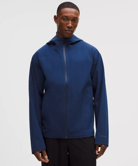 Man wearing a blue jacket on a white background