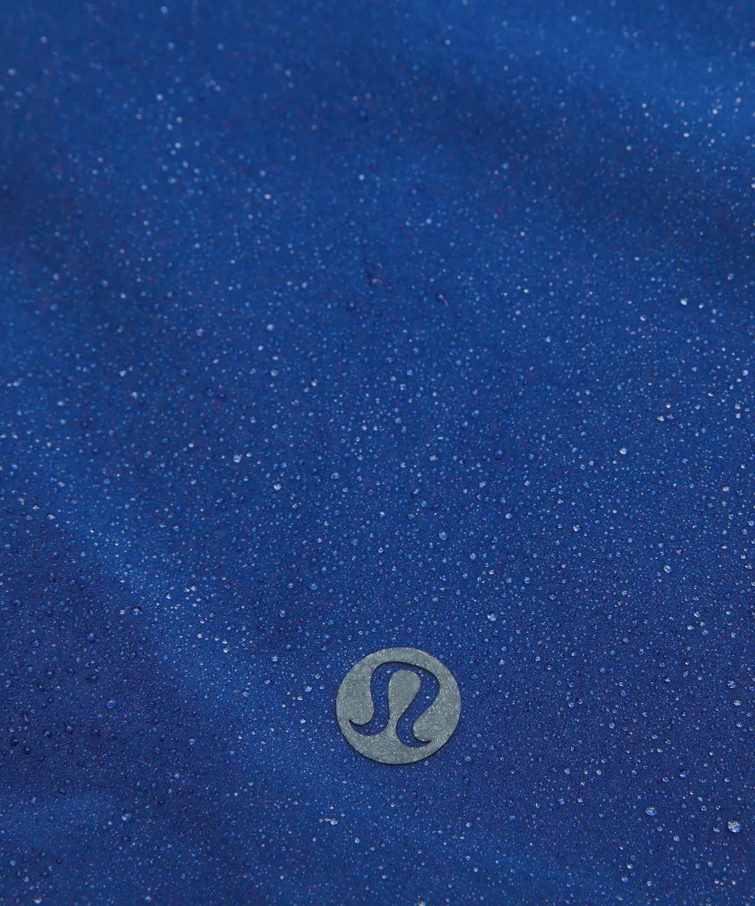 Blue fabric with a Lululemon logo in the center