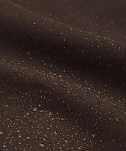 Close-up of water droplets on a dark surface