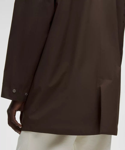 Brown jacket worn by a person on a white background