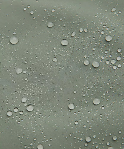 Water droplets on a greenish surface