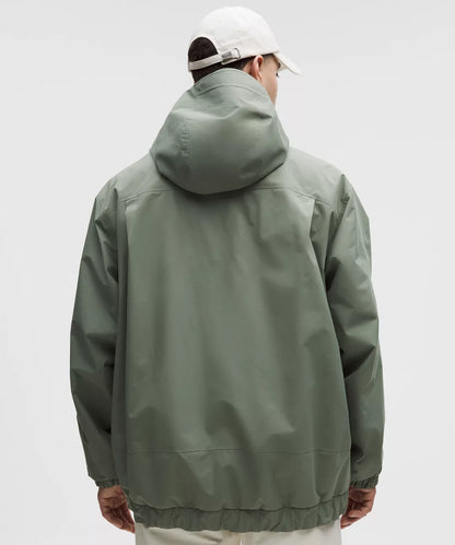 Person wearing a green jacket with a hood on a white background