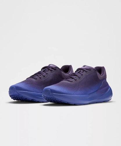 Pair of blue running shoes on a light gray background
