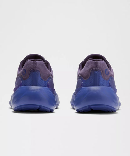 Blue athletic shoes shown from the back on a white background