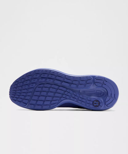 Blue shoe sole on a light gray background