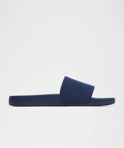 Navy blue slide sandal on a light gray background