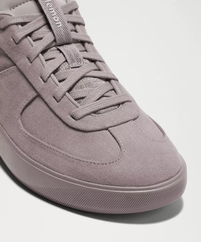 Light purple sneaker on a white background