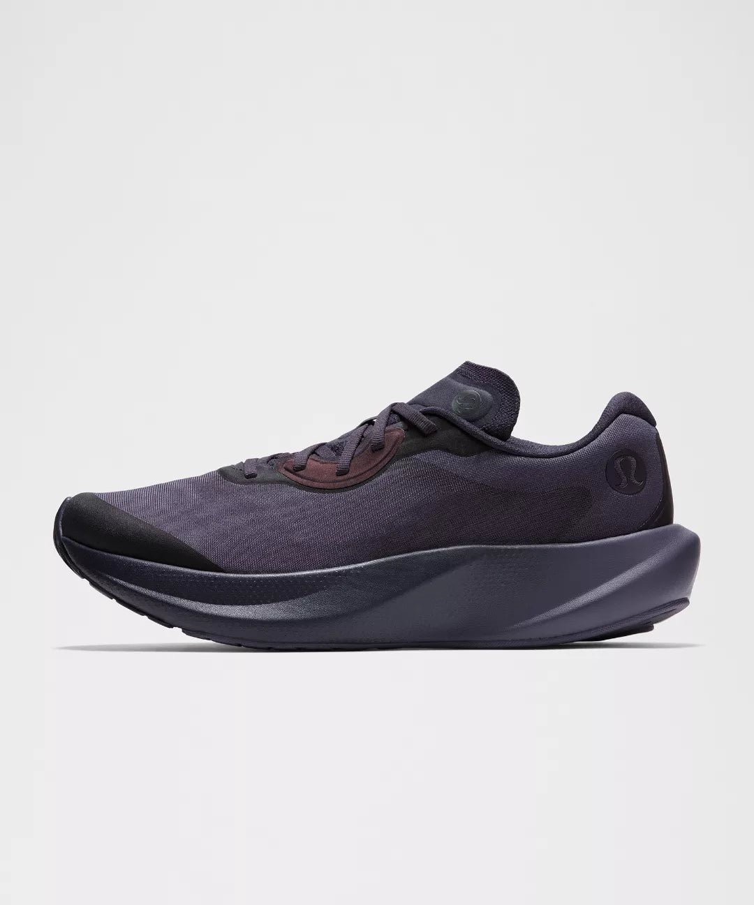 Dark gray athletic shoe on a light gray background