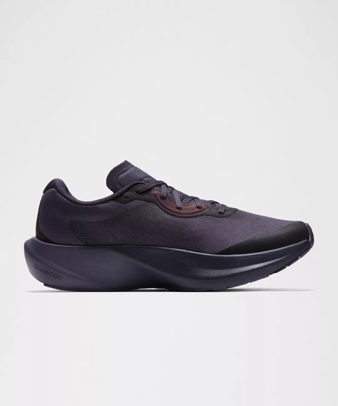 Black athletic shoe on a light gray background