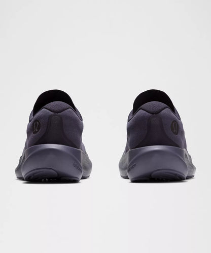 Pair of dark gray athletic shoes on a white background