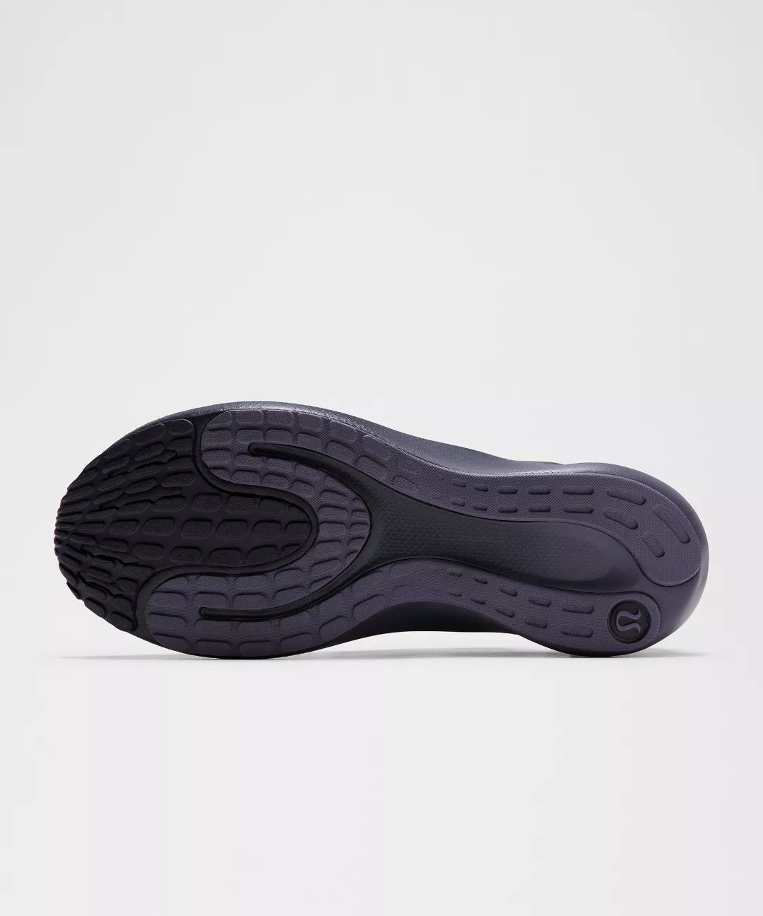 Black shoe sole on a light gray background
