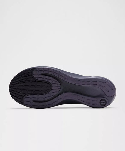 Black shoe sole on a light gray background
