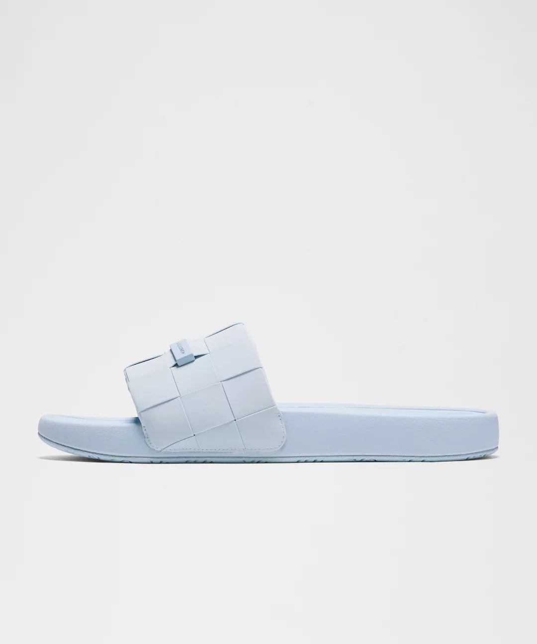 Light blue sandal on a light gray background