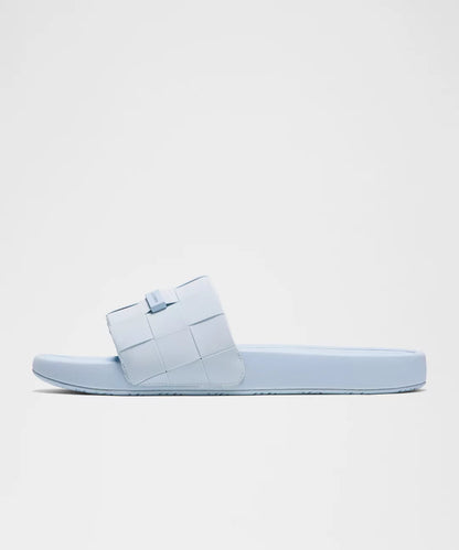 Light blue sandal on a light gray background
