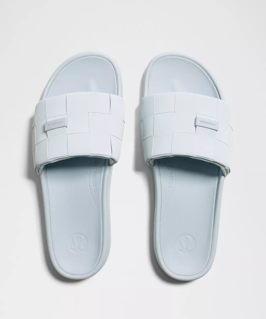Pair of light blue slides on a white background