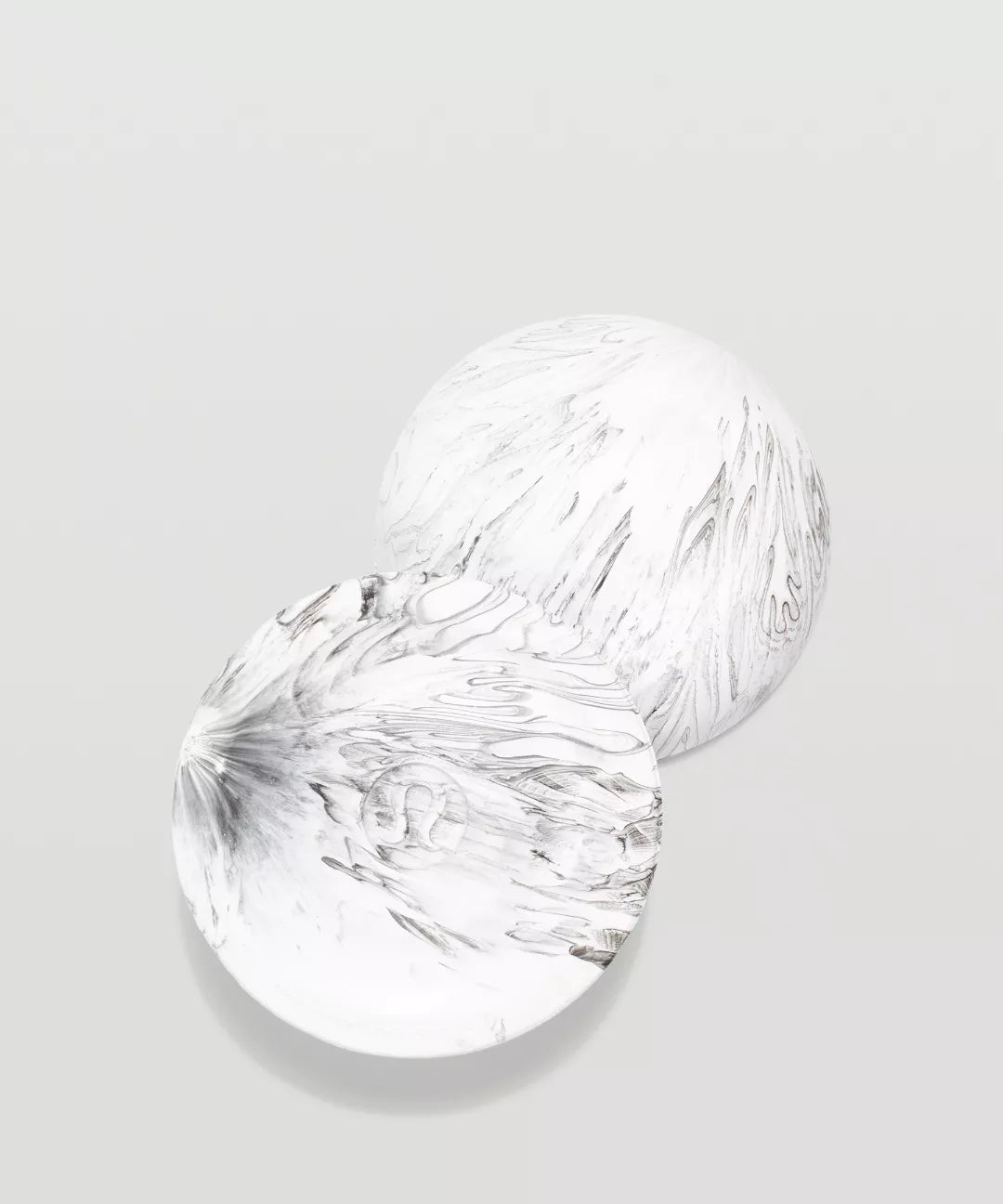 Two clear glass bowls on a light gray background