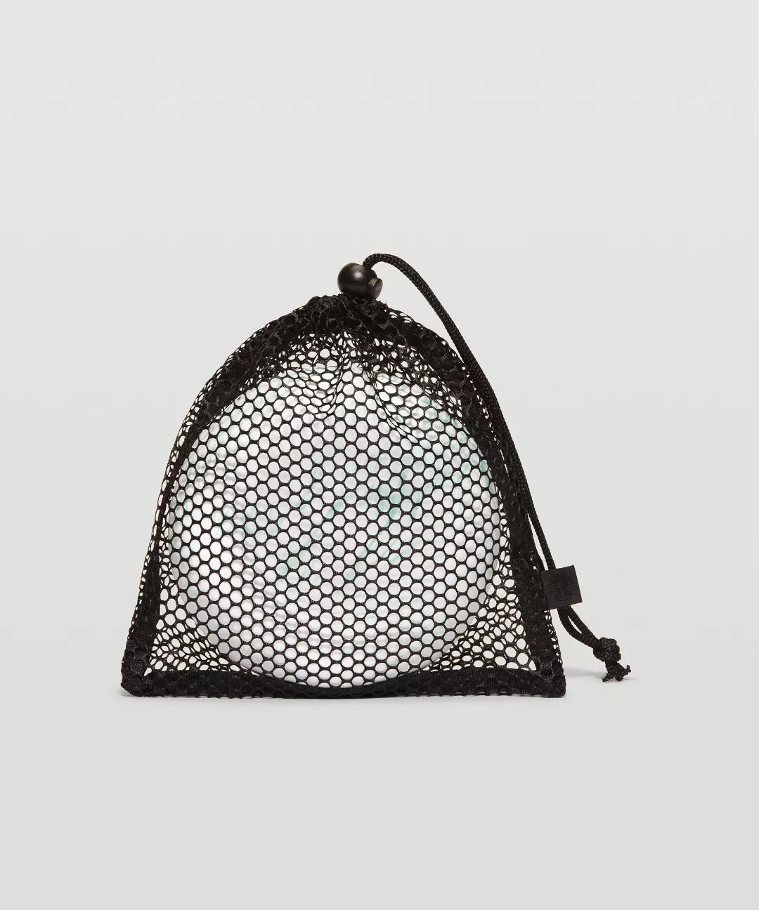 Black mesh drawstring bag on a light gray background