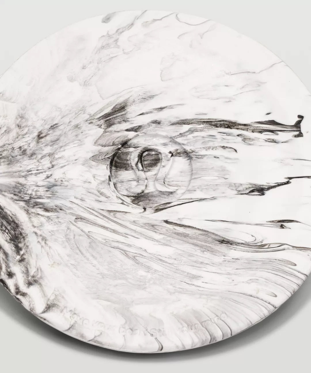 Marble-patterned surface with a central circular design