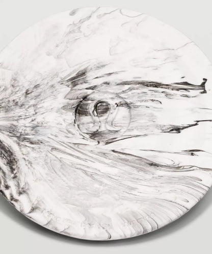 Marble-patterned surface with a central circular design