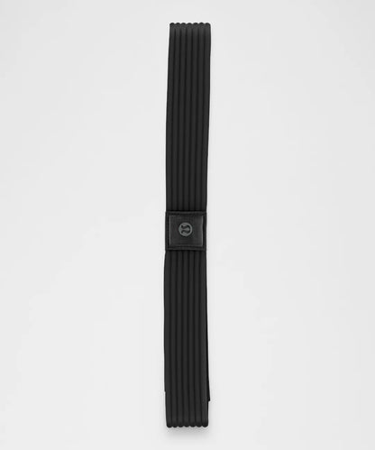 Black belt with a buckle on a light gray background