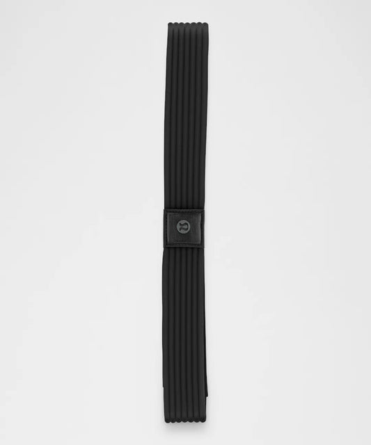 Black belt with a buckle on a light gray background