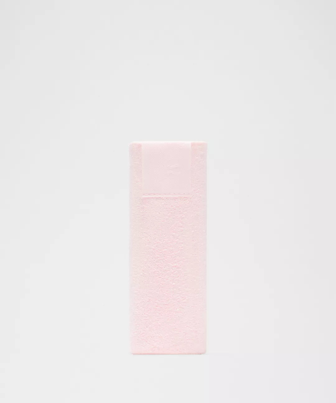 Pink towel on a light gray background