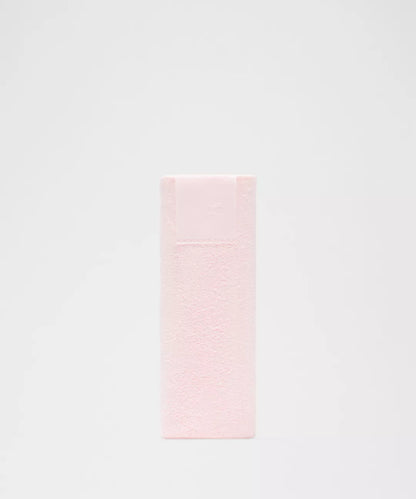 Pink towel on a light gray background