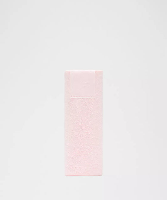 Pink towel on a light gray background