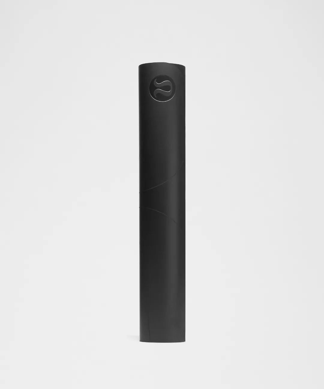 Black yoga mat with a brand logo on a light gray background