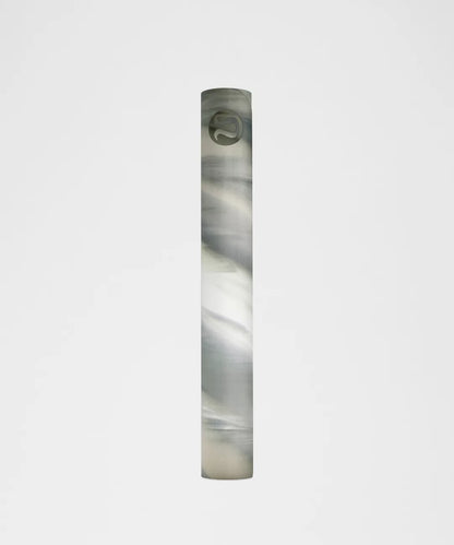 Marbled cylindrical object on a light gray background