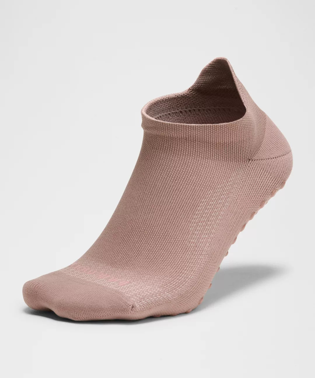 Pink ankle sock on a light gray background