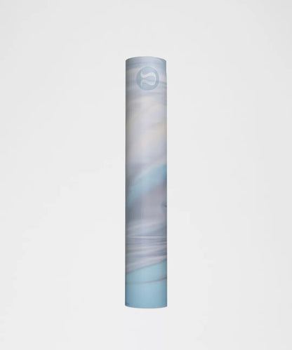 Yoga mat with a gradient design on a light gray background