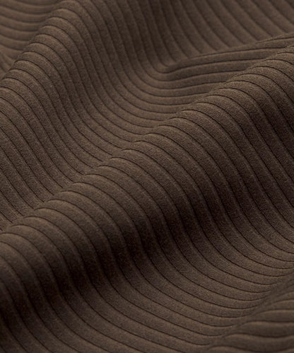 Close-up of brown textured fabric with wavy pattern