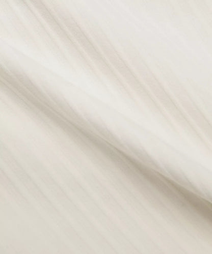 Close-up of beige fabric with a subtle pattern