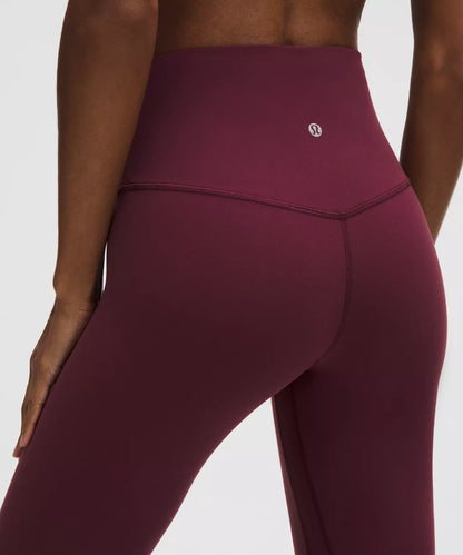Maroon leggings with a brand logo on a white background